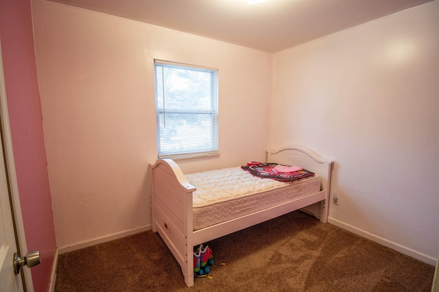 bedroom with carpet and baseboards