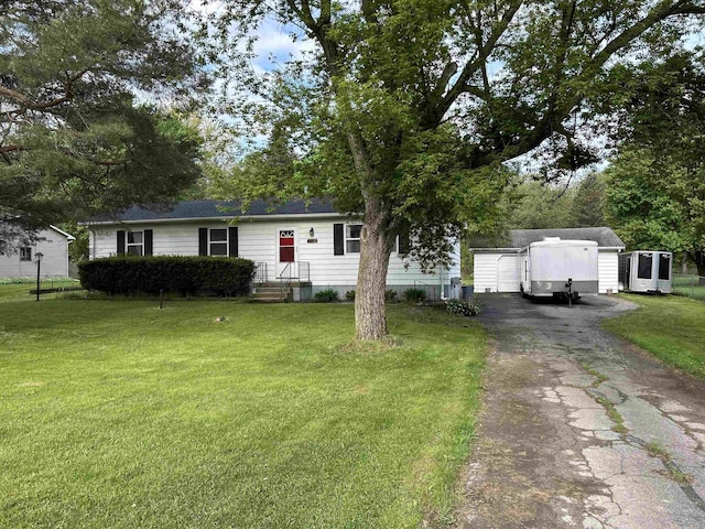 6455 Turner Rd, Flushing, MI 48433 - view of front of property featuring driveway, a front yard, and an outbuilding