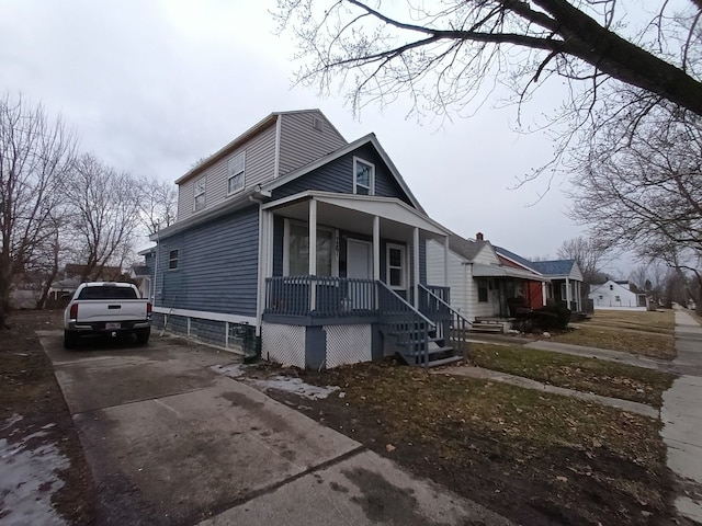 view of front of house with a porch and concrete driveway