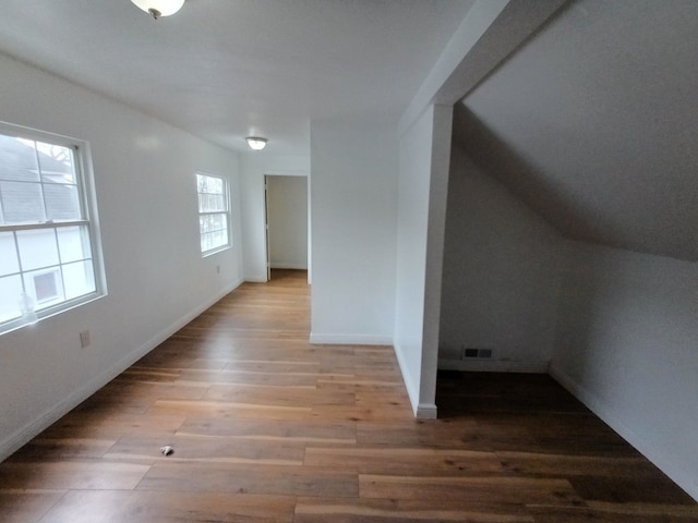 interior space featuring visible vents, baseboards, and wood finished floors