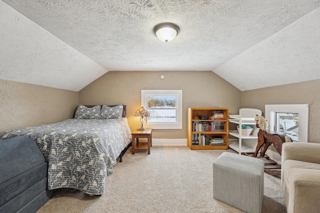 bedroom featuring vaulted ceiling, multiple windows, carpet flooring, and a textured ceiling