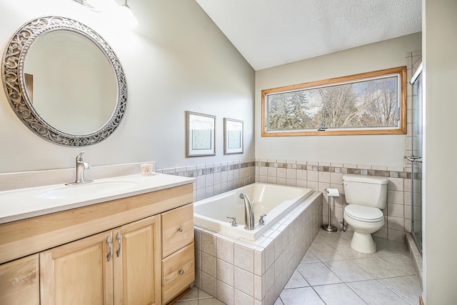 full bathroom with a garden tub, toilet, a textured ceiling, vanity, and tile patterned flooring