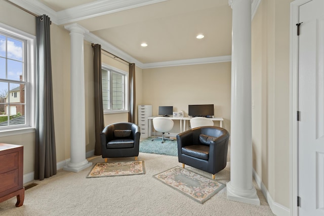 sitting room featuring plenty of natural light, carpet flooring, decorative columns, and crown molding