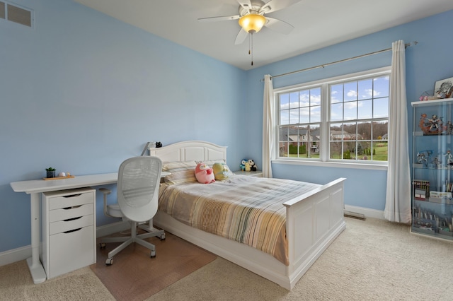 bedroom with baseboards, ceiling fan, visible vents, and light colored carpet