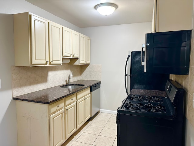 kitchen with light tile patterned floors, tasteful backsplash, black gas stove, a sink, and dishwasher