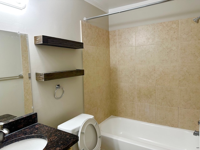 bathroom with tub / shower combination, vanity, and toilet