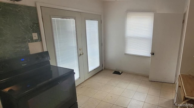 entryway featuring french doors and baseboards