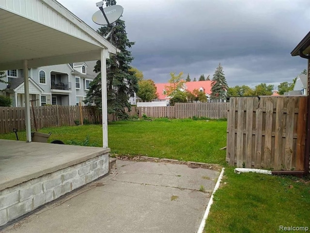 view of yard featuring a patio area and a fenced backyard