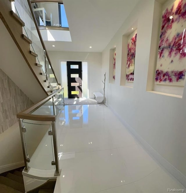 interior space featuring stairway, recessed lighting, tile patterned floors, and baseboards