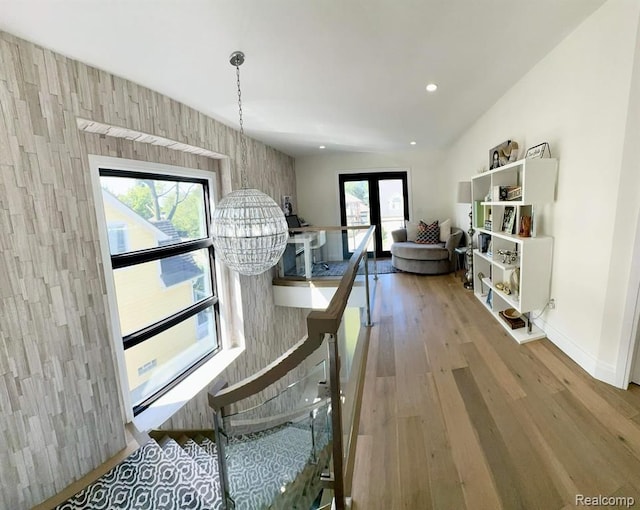 dining area featuring recessed lighting, a notable chandelier, wood finished floors, baseboards, and french doors