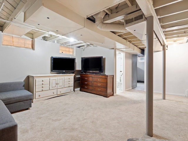 carpeted living room featuring visible vents and baseboards