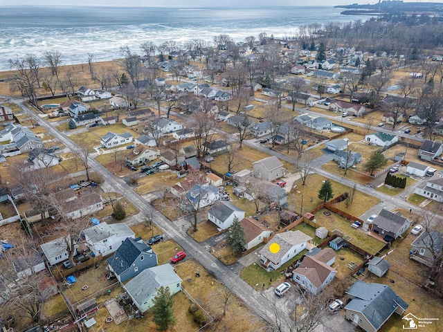 bird's eye view with a residential view and a water view