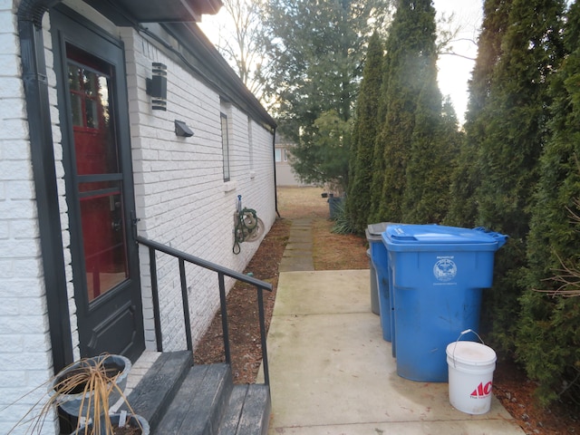 view of side of property featuring brick siding