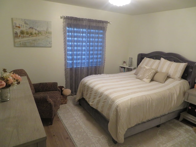 bedroom with wood finished floors