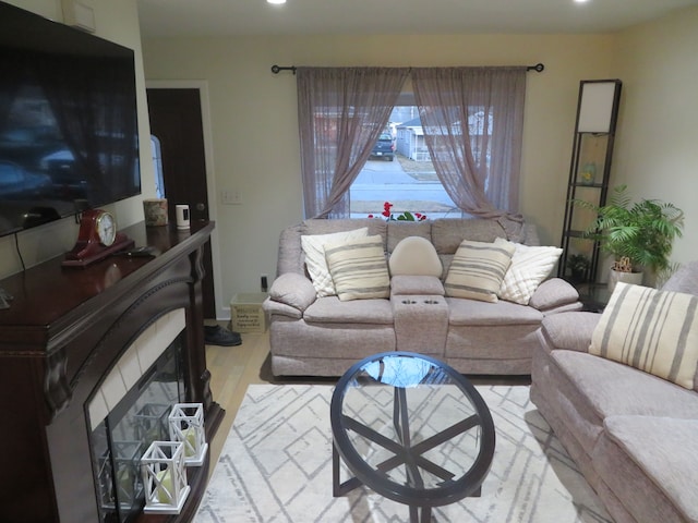 living area with recessed lighting and wood finished floors