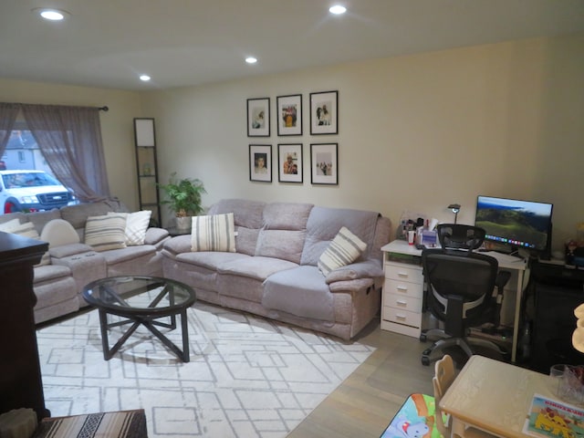 living room with recessed lighting and wood finished floors