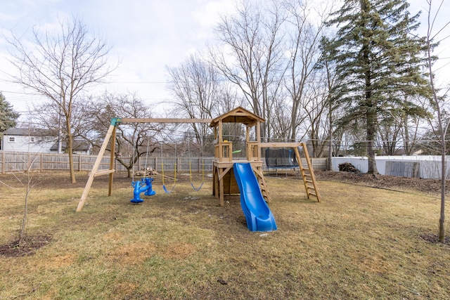 view of jungle gym featuring a yard and fence