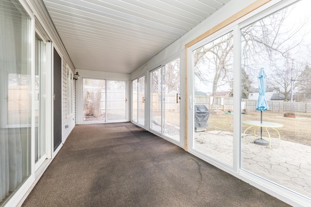 unfurnished sunroom featuring plenty of natural light