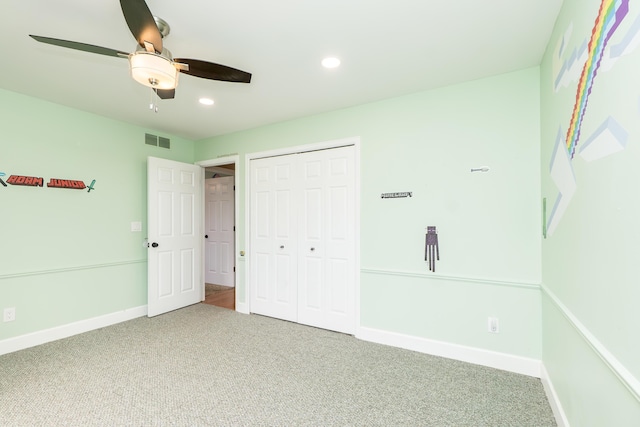 unfurnished bedroom featuring recessed lighting, carpet flooring, visible vents, baseboards, and a closet