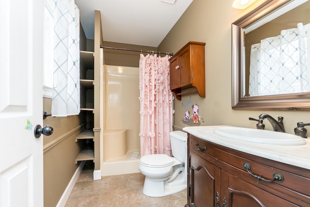 full bathroom featuring tile patterned flooring, toilet, vanity, baseboards, and a shower stall