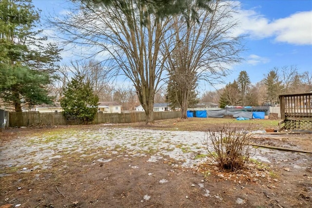 view of yard with a fenced in pool, a fenced backyard, and a wooden deck