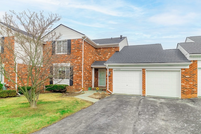 view of front of home with brick siding, a shingled roof, a front yard, a garage, and driveway