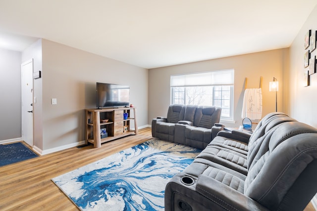 living room with baseboards and wood finished floors