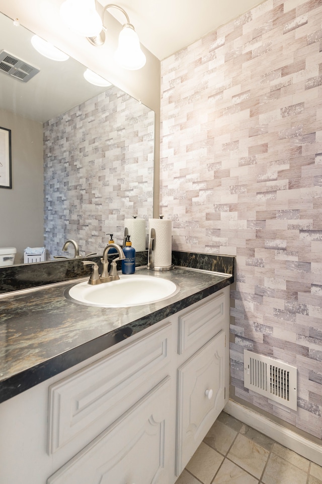 bathroom with visible vents and vanity