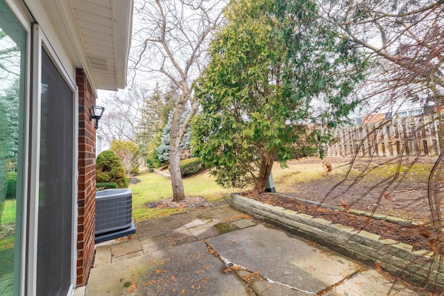 view of patio featuring fence and central AC