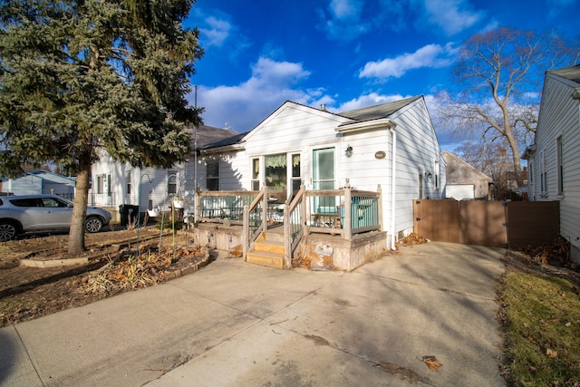 view of front of house featuring a gate and a deck