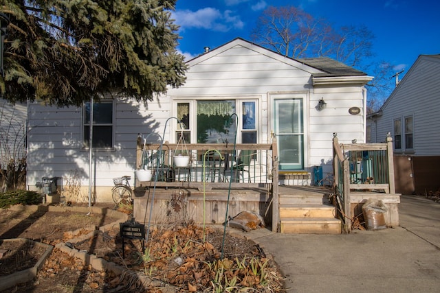 view of front of property with a wooden deck