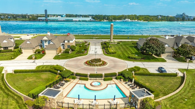 birds eye view of property featuring a water view