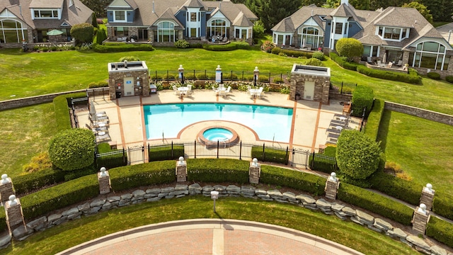 view of pool featuring a residential view, fence, and a lawn