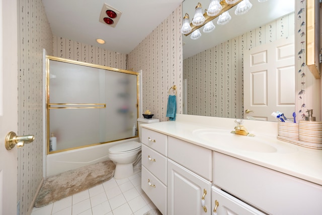 full bathroom featuring tile patterned flooring, toilet, shower / bath combination with glass door, vanity, and wallpapered walls