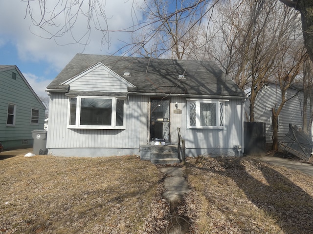 view of front of home featuring roof with shingles