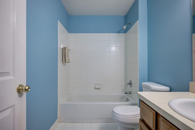 full bath with shower / bath combination, vanity, toilet, and tile patterned floors