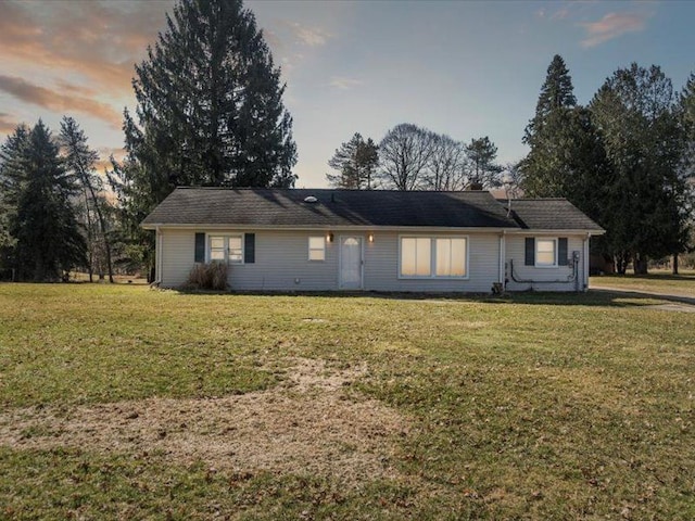 ranch-style house with a lawn