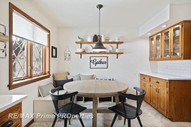 dining room with marble finish floor and breakfast area