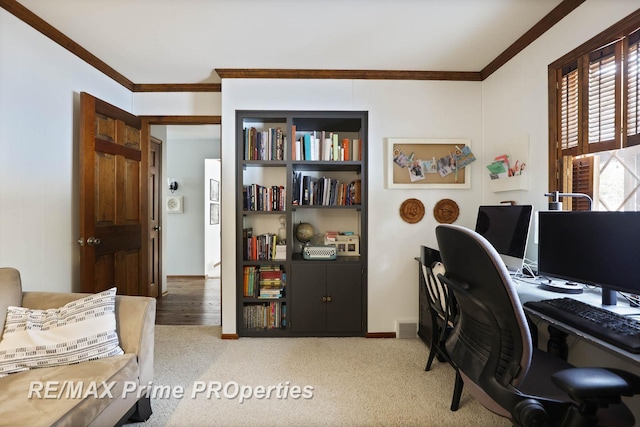 office space featuring baseboards, crown molding, and carpet flooring