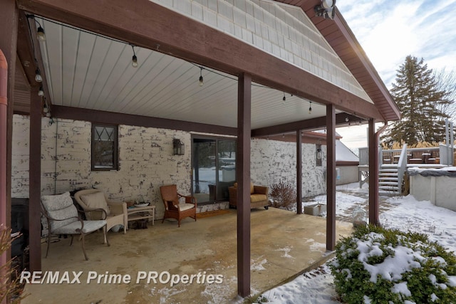 view of snow covered patio