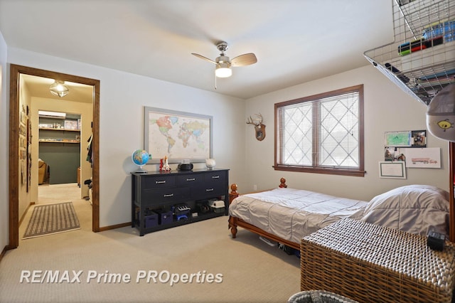 bedroom with light carpet, a ceiling fan, and baseboards