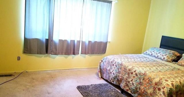 bedroom featuring carpet and visible vents