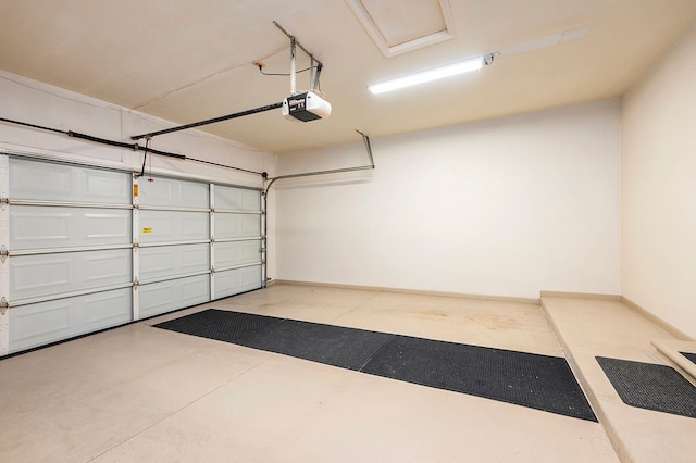 garage with baseboards and a garage door opener