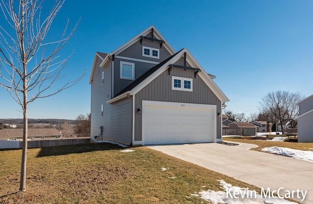 view of home's exterior with a garage, driveway, and a lawn