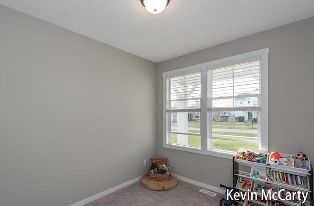 game room featuring baseboards, visible vents, and carpet flooring