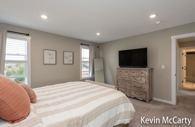 bedroom featuring light carpet, baseboards, and recessed lighting