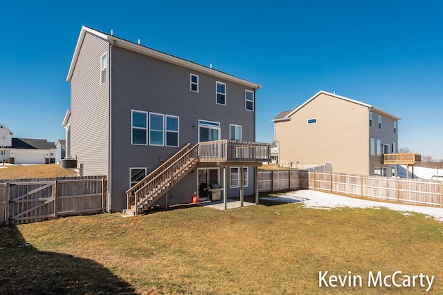 back of house with a fenced backyard, a yard, stairway, a gate, and a patio area