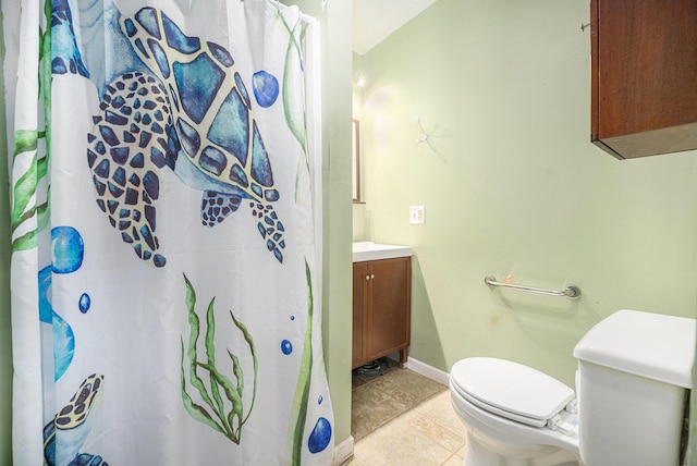 bathroom with a shower with shower curtain, vanity, toilet, and baseboards