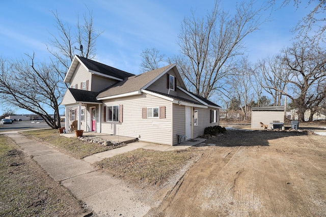 view of side of home featuring driveway