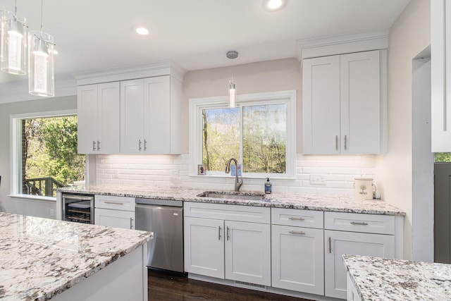 kitchen with dishwasher, wine cooler, a sink, and white cabinetry